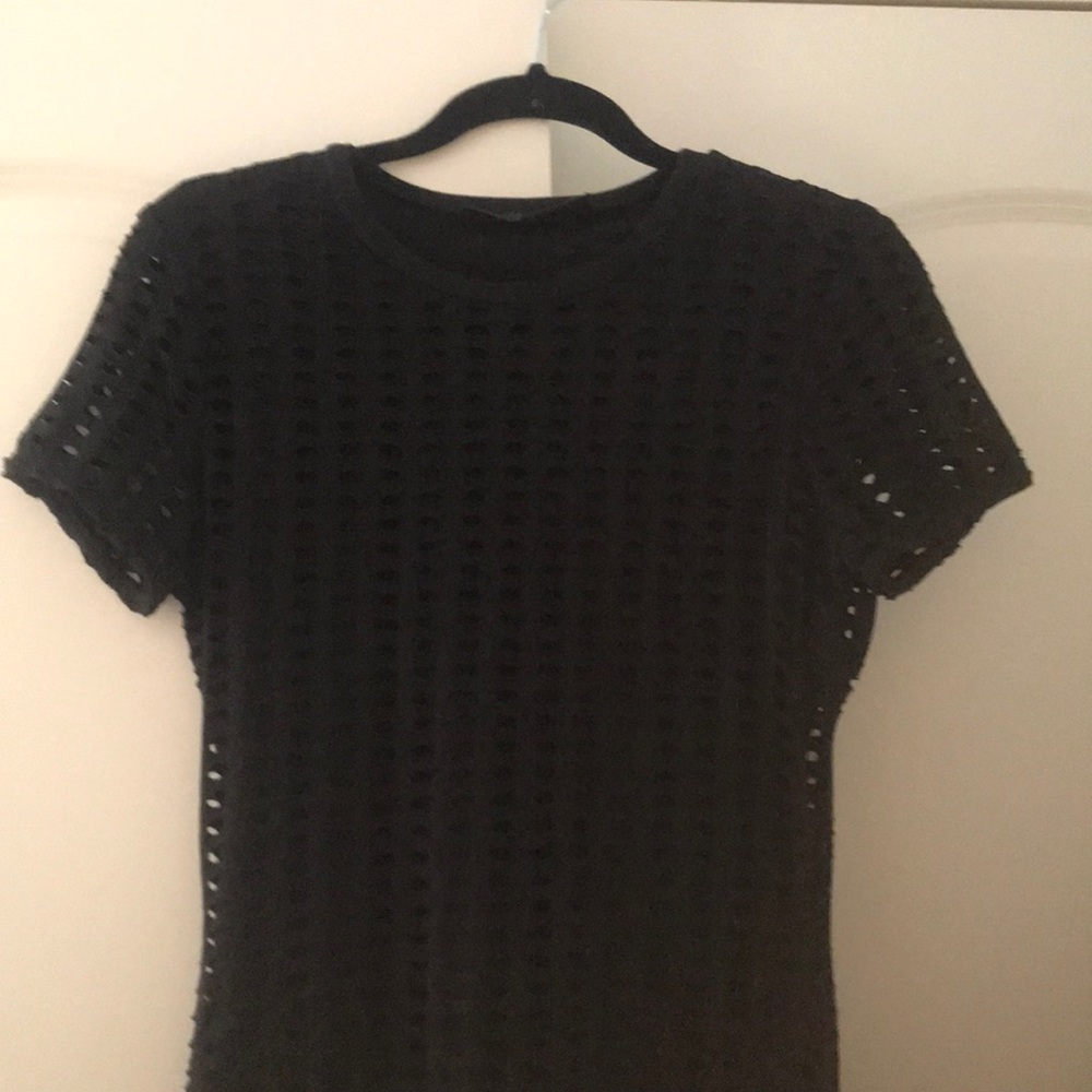 Black fitted dress with cutouts.